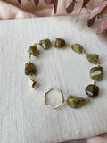 B2301 - gf smooth nugget style green garnet with forged hexagon link